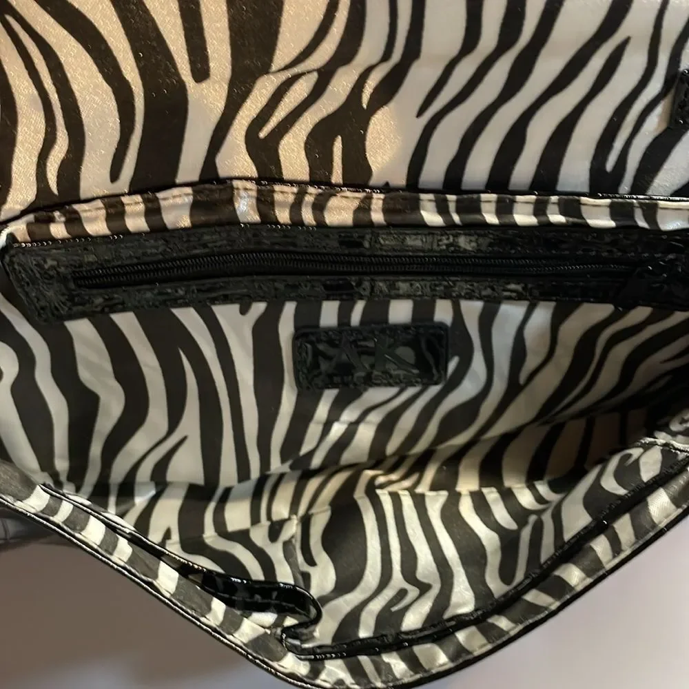 Anne Klein woman’s black handbag/purse/clutch style zebra pattern interior